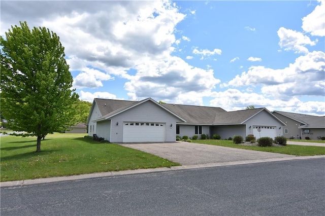 101 Baileyville Ct, Knapp, WI 54749 - ranch-style home with a garage, driveway, and a front yard