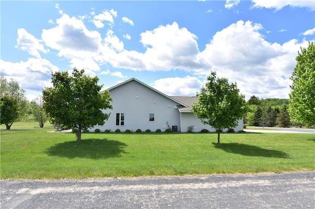 101 Baileyville Ct, Knapp, WI 54749 - view of side of home featuring a yard and central AC unit