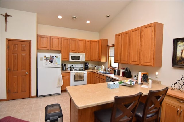 101 Baileyville Ct, Knapp, WI 54749 - kitchen with white appliances, a peninsula, light countertops, a kitchen bar, and lofted ceiling