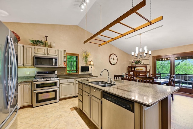 2511 S Natures Ridge Rd, Beloit, WI 53511 - kitchen with stainless steel appliances, a sink, vaulted ceiling, a chandelier, and cream cabinetry