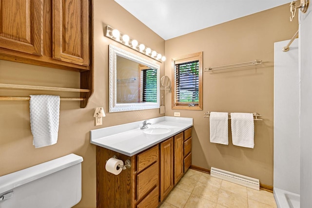 2511 S Natures Ridge Rd, Beloit, WI 53511 - bathroom featuring toilet, vanity, a shower, baseboards, and tile patterned floors