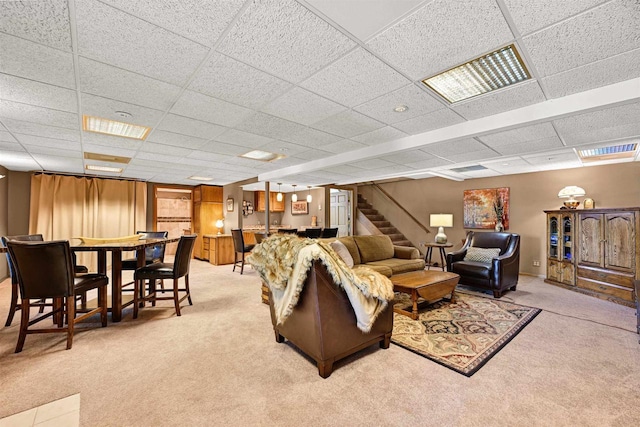 2511 S Natures Ridge Rd, Beloit, WI 53511 - living room with light carpet, stairway, a drop ceiling, and bar area