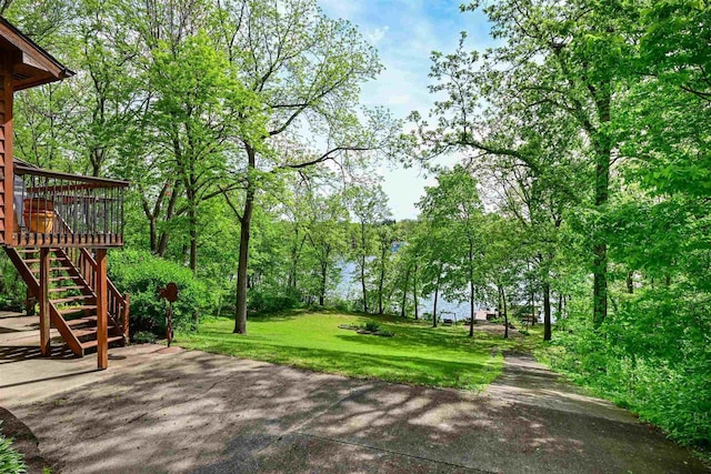 2511 S Natures Ridge Rd, Beloit, WI 53511 - view of green lawn featuring stairway, a deck, and a patio