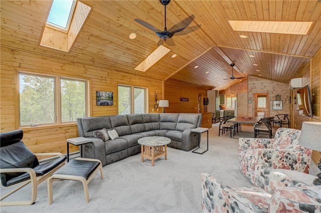 3844 State Road 77, Danbury, WI 54830 - living area with a skylight, vaulted ceiling, wood walls, carpet, and ceiling fan