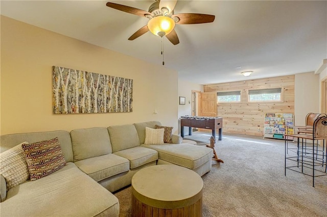 3844 State Road 77, Danbury, WI 54830 - living area featuring wood walls, carpet flooring, and a ceiling fan