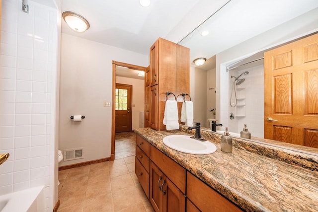 W267N6781 Beacon Hills Dr, Lisbon, WI 53089 - bathroom featuring toilet, vanity, tile patterned floors, baseboards, and bathtub / shower combination