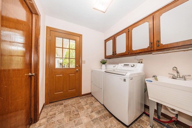 W267N6781 Beacon Hills Dr, Lisbon, WI 53089 - laundry room featuring cabinet space, washer and dryer, stone finish floors, and baseboards