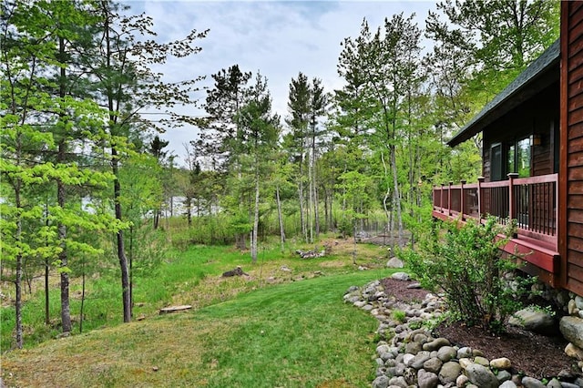 10435 W Murphy Blvd, Hayward, WI 54843 - view of yard with a wooden deck