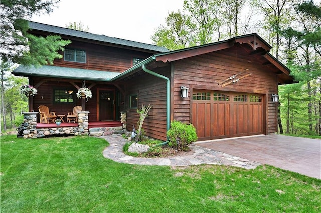 10435 W Murphy Blvd, Hayward, WI 54843 - chalet / cabin with a porch, a garage, a front lawn, and driveway