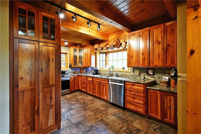 10435 W Murphy Blvd, Hayward, WI 54843 - kitchen featuring dishwasher, gas range, wooden ceiling with exposed beams, a sink, and brown cabinetry