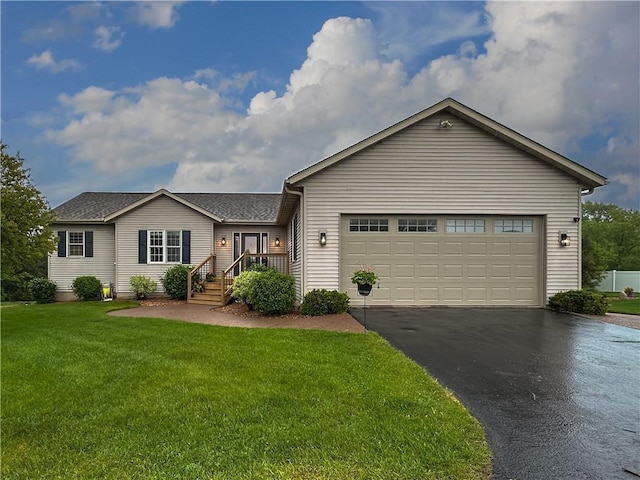 N1816 950th St, Eau Claire, WI 54701 - ranch-style house with asphalt driveway, a front yard, a garage, and a shingled roof