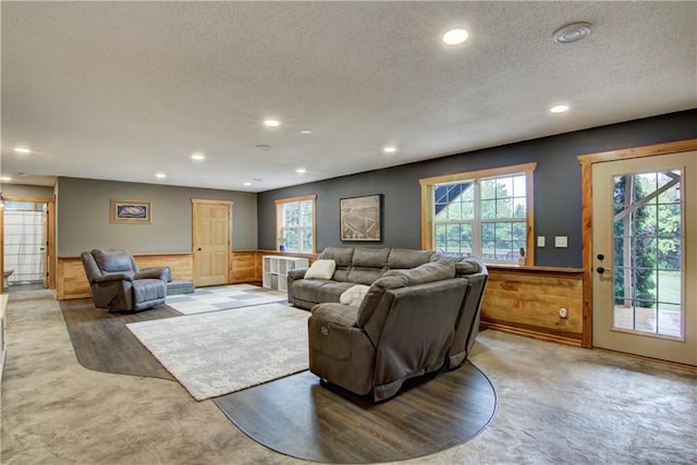 N1816 950th St, Eau Claire, WI 54701 - living room with a textured ceiling, a wainscoted wall, and recessed lighting