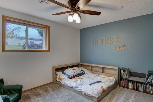 N1816 950th St, Eau Claire, WI 54701 - carpeted bedroom featuring baseboards, a ceiling fan, and a textured ceiling