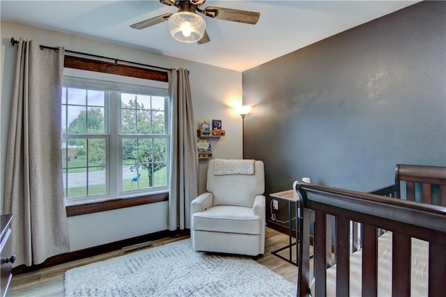 N1816 950th St, Eau Claire, WI 54701 - bedroom with multiple windows, wood finished floors, and ceiling fan