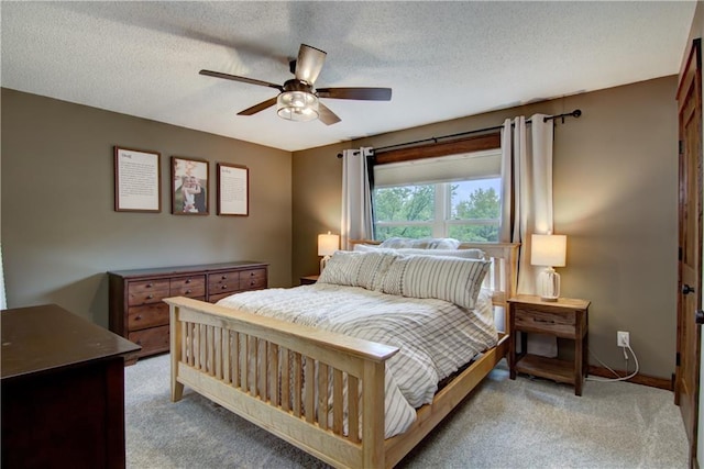 N1816 950th St, Eau Claire, WI 54701 - bedroom with light carpet, a ceiling fan, and a textured ceiling