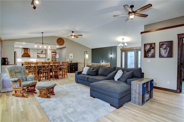 N1816 950th St, Eau Claire, WI 54701 - living room with ceiling fan, light wood-type flooring, vaulted ceiling, and a chandelier