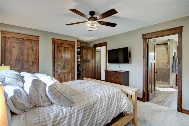 N1816 950th St, Eau Claire, WI 54701 - bedroom featuring a ceiling fan, baseboards, carpet flooring, and connected bathroom