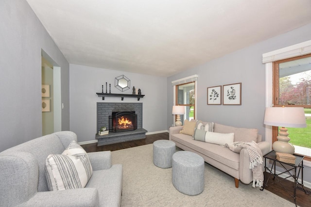 1429 W River Oaks Ln, Mequon, WI 53092 - living room with wood finished floors, a fireplace, and baseboards