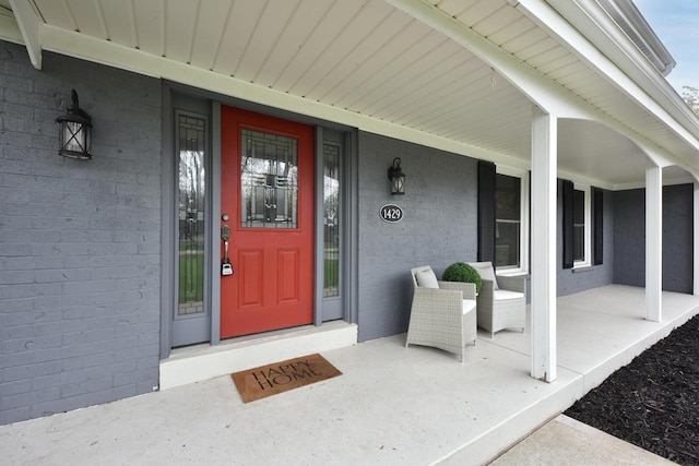 1429 W River Oaks Ln, Mequon, WI 53092 - entrance to property featuring a porch and brick siding