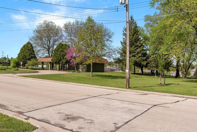 2109 Salisbury Rd, West Bend, WI 53090 - view of front of property with a front yard, concrete driveway, and a carport