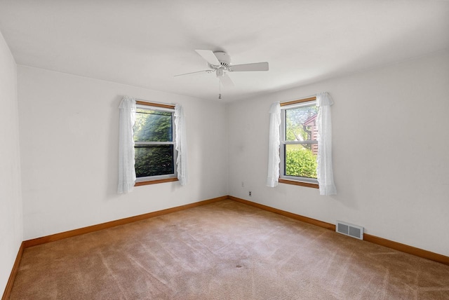 2109 Salisbury Rd, West Bend, WI 53090 - carpeted empty room featuring baseboards and ceiling fan