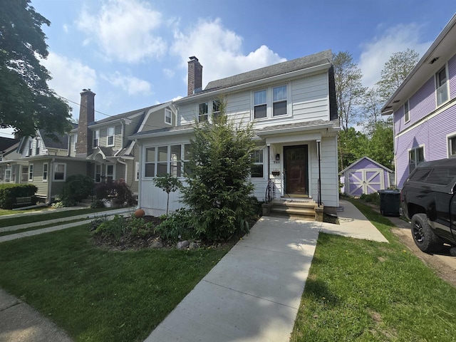 644 Crandall St, Madison, WI 53711 - view of front facade featuring a front lawn and a chimney