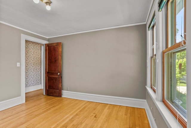 644 Crandall St, Madison, WI 53711 - spare room featuring crown molding, baseboards, and wood finished floors