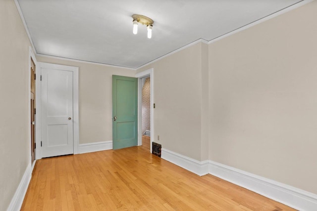 644 Crandall St, Madison, WI 53711 - empty room with light wood-style flooring, ornamental molding, and baseboards