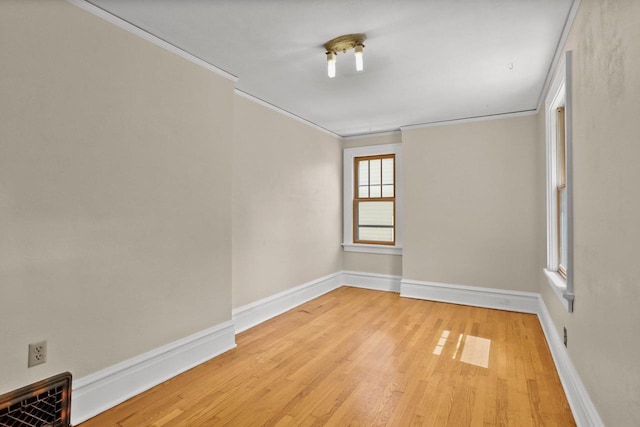 644 Crandall St, Madison, WI 53711 - spare room with crown molding, light wood-style flooring, and baseboards
