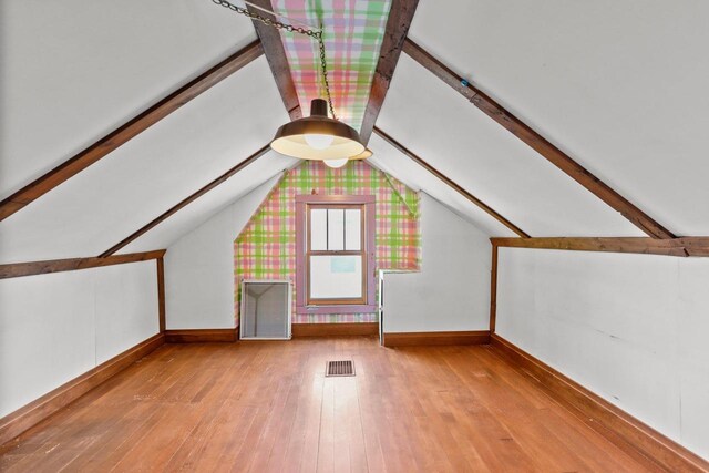 644 Crandall St, Madison, WI 53711 - additional living space featuring wood-type flooring and baseboards