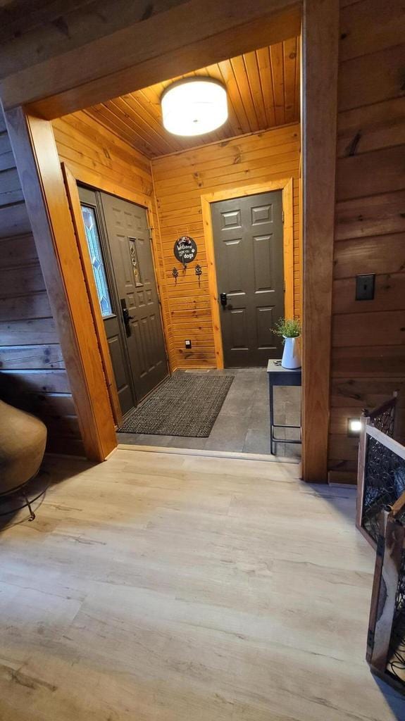 610 Fox Ridge Ct, Nekoosa, WI 54457 - foyer entrance with wood walls, wood ceiling, and wood finished floors