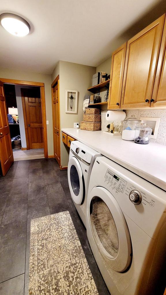 610 Fox Ridge Ct, Nekoosa, WI 54457 - washroom featuring cabinet space and washer and dryer