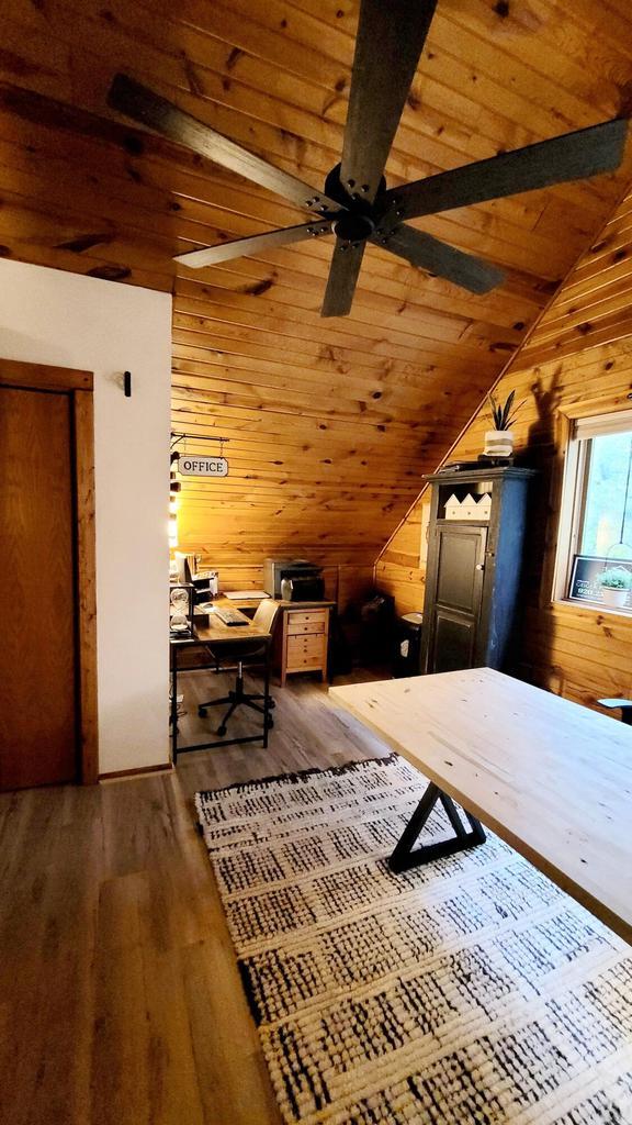 610 Fox Ridge Ct, Nekoosa, WI 54457 - bedroom with wooden walls, wood finished floors, wooden ceiling, and a desk