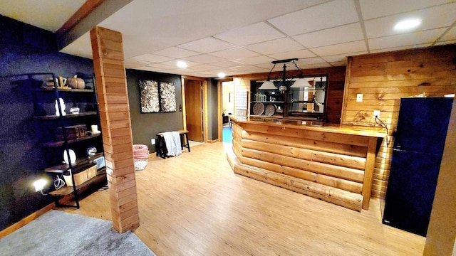 610 Fox Ridge Ct, Nekoosa, WI 54457 - indoor dry bar with wood finished floors, decorative columns, and a paneled ceiling