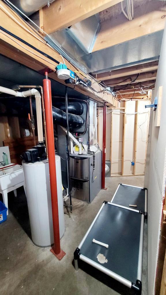 610 Fox Ridge Ct, Nekoosa, WI 54457 - unfinished below grade area featuring a water softener system
