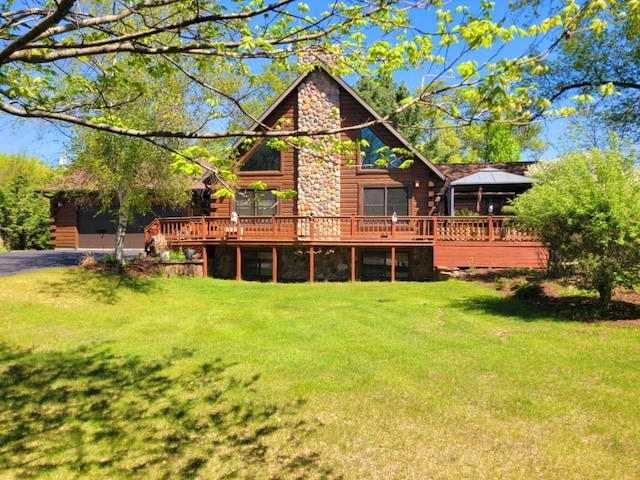 610 Fox Ridge Ct, Nekoosa, WI 54457 - back of house with log exterior, a deck, and a lawn