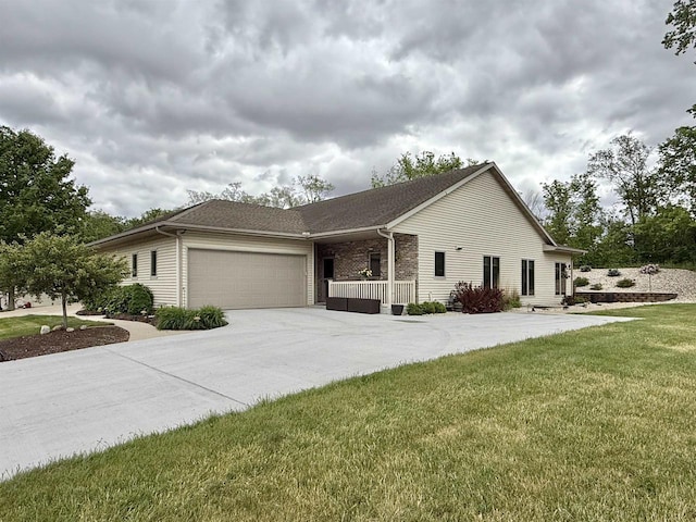 2728 E Ridge Rd, Beloit, WI 53511 - ranch-style home with a garage, a front yard, concrete driveway, and brick siding