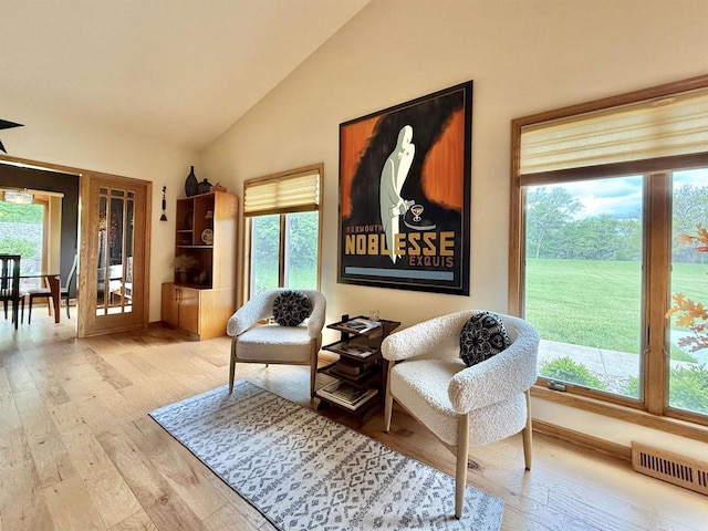 2728 E Ridge Rd, Beloit, WI 53511 - sitting room with hardwood / wood-style floors, healthy amount of natural light, high vaulted ceiling, and baseboards