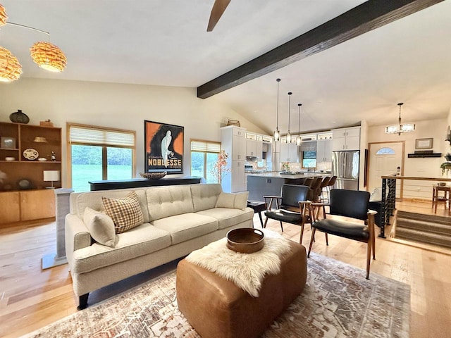 2728 E Ridge Rd, Beloit, WI 53511 - living area featuring light wood finished floors, a ceiling fan, and a chandelier
