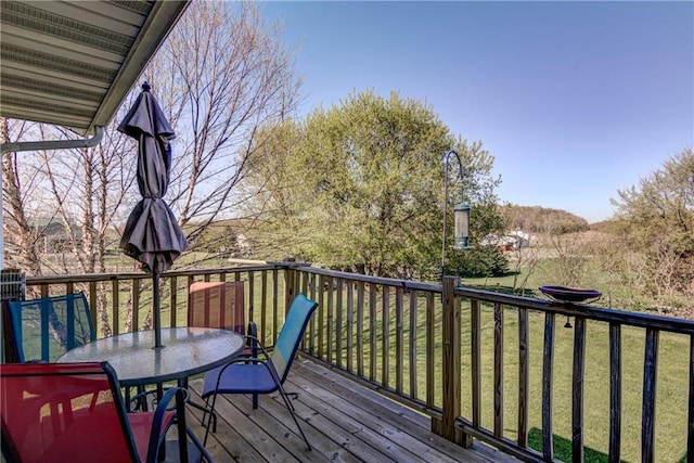 N4907 572nd St, Menomonie, WI 54751 - deck featuring outdoor dining space and a yard