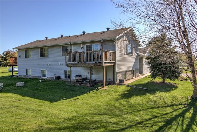 N4907 572nd St, Menomonie, WI 54751 - rear view of house with a lawn and a deck