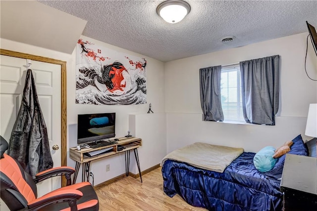 N4907 572nd St, Menomonie, WI 54751 - bedroom featuring a textured ceiling and wood finished floors