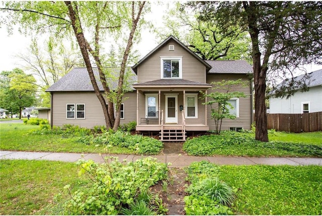 428 N 4th St, River Falls, WI 54022 - traditional-style house with a porch and a shingled roof