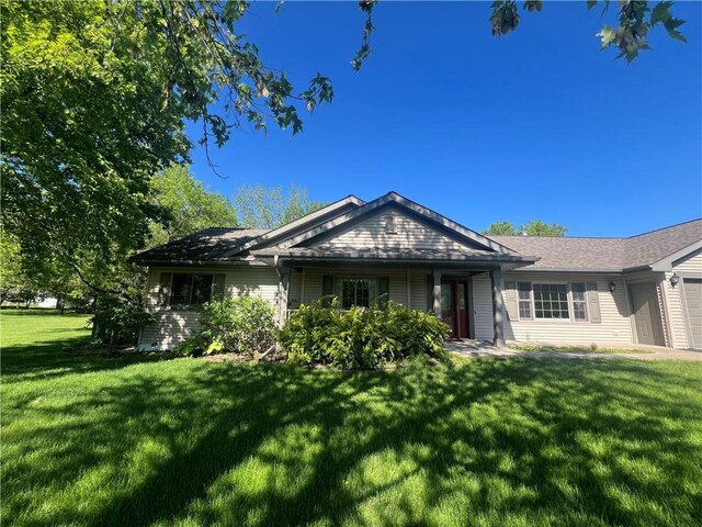 N2673 464th St, Menomonie, WI 54751 - view of front of property with a front lawn and an attached garage
