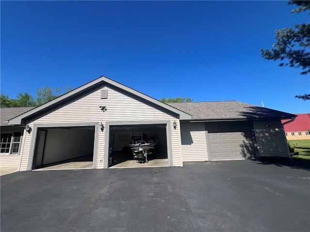 N2673 464th St, Menomonie, WI 54751 - view of property exterior with roof with shingles and a garage