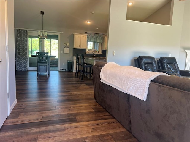 N2673 464th St, Menomonie, WI 54751 - living area featuring dark wood finished floors, recessed lighting, a chandelier, and baseboards