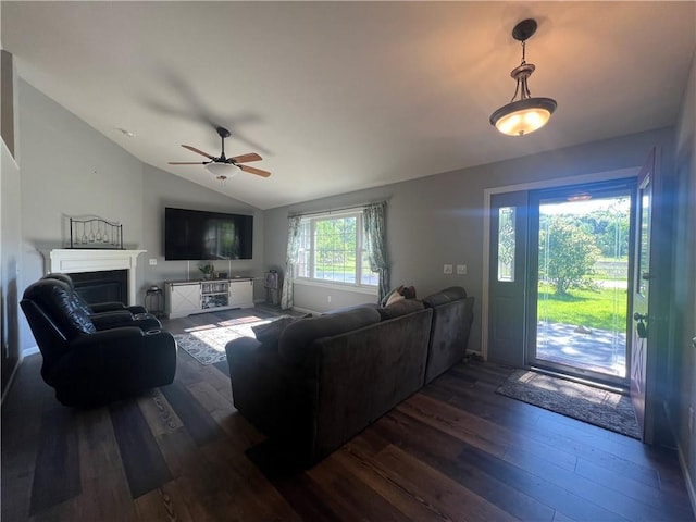 N2673 464th St, Menomonie, WI 54751 - living room featuring lofted ceiling, dark wood-style flooring, a ceiling fan, and a fireplace