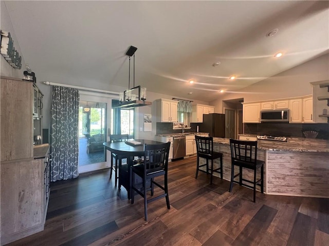 N2673 464th St, Menomonie, WI 54751 - dining room featuring dark wood finished floors and lofted ceiling