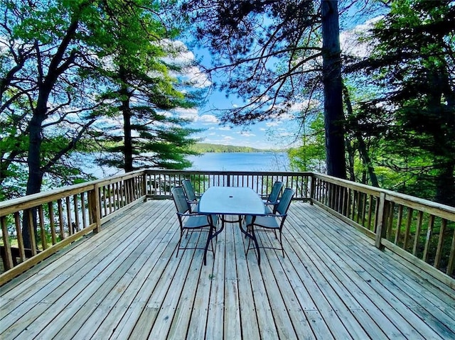 W6974 Bankers Dr, Minong, WI 54859 - wooden terrace featuring outdoor dining area and a water view