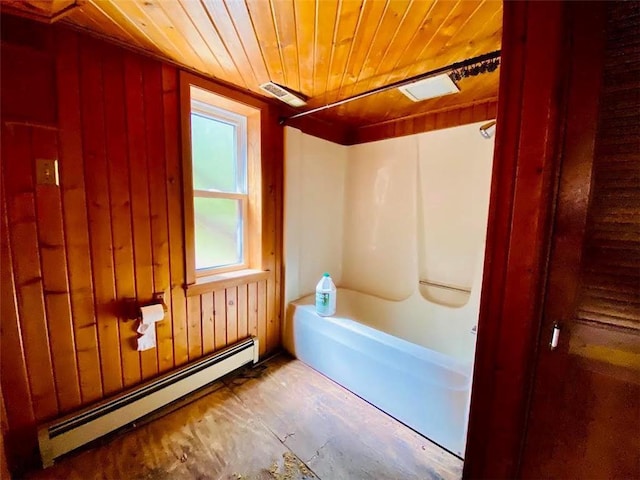 6974 W Bankers Dr, Minong, WI 54859 - full bathroom featuring a baseboard heating unit, wooden ceiling, bathtub / shower combination, and wooden walls